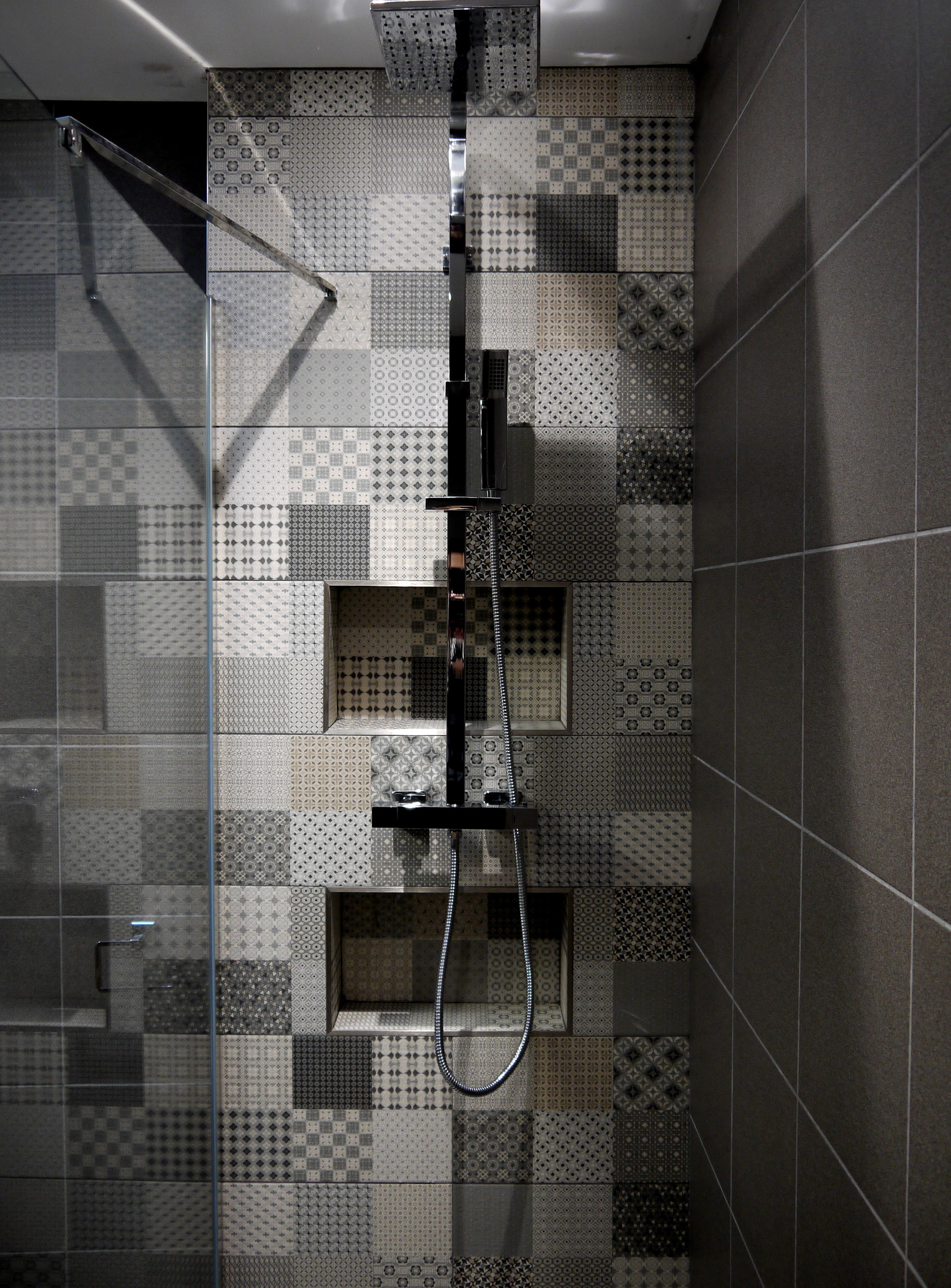 Decorative tiles and neatly framed recessed shelves.